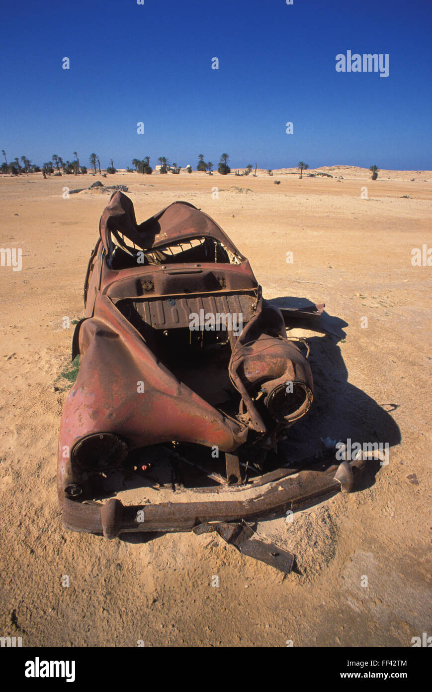 TUN, Tunisia, Jarbah Island, rusty car at the beach near Houmt Souk.  TUN, Tunesien, Insel Djerba, verrostetes Auto am Strand na Stock Photo