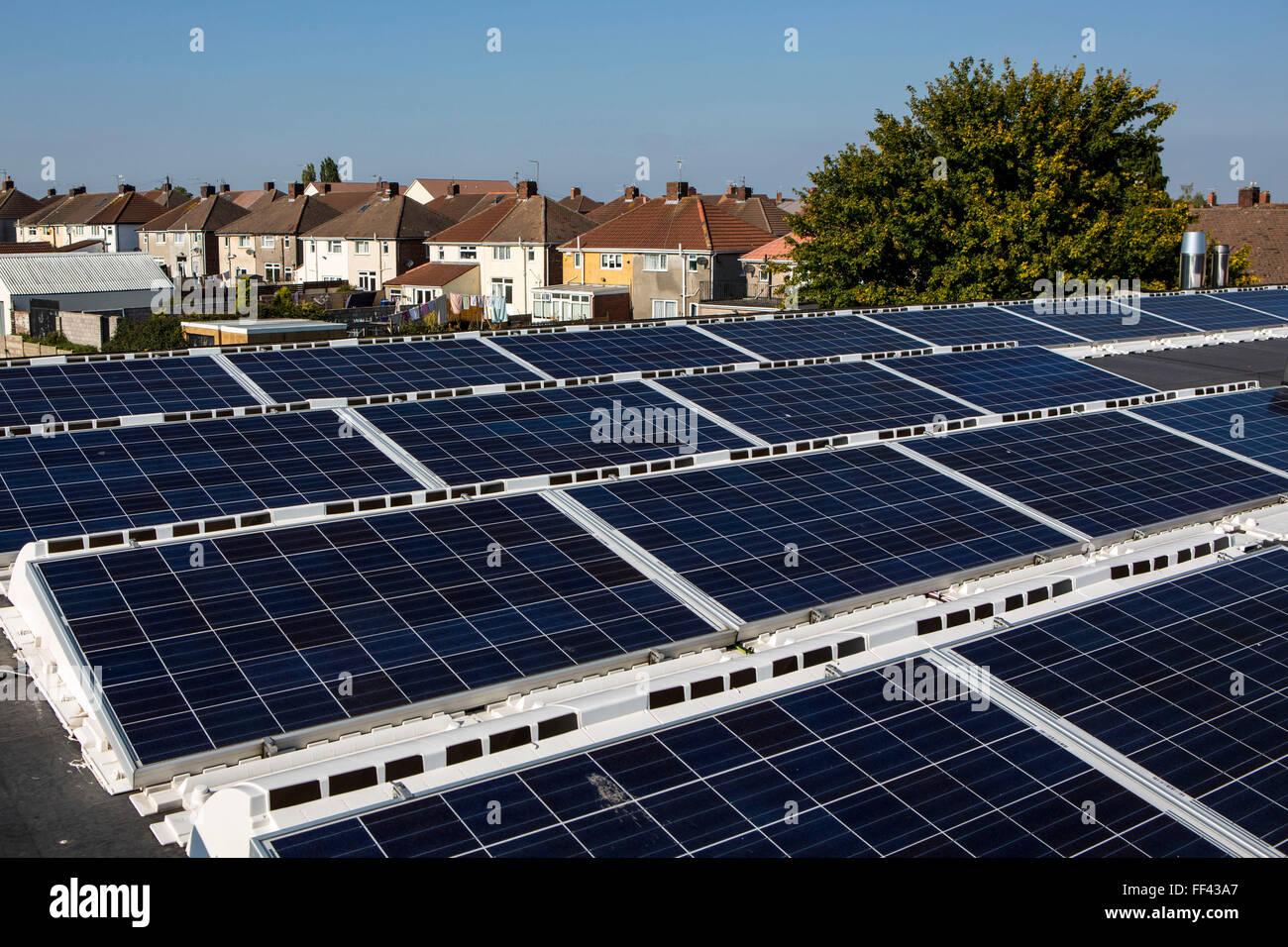 The  25kW solar panel array on the roof of Knowle West Media Centre. Supported by Bristol Energy, a community-owned energy cooperative, growing Greater Bristol’s local green energy supply and making the benefits available to all. Bristol, UK. Stock Photo