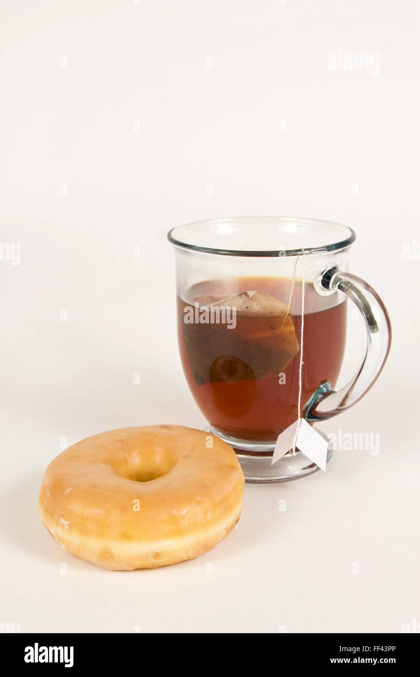 https://c8.alamy.com/comp/FF43PP/hot-tea-with-donut-FF43PP.jpg
