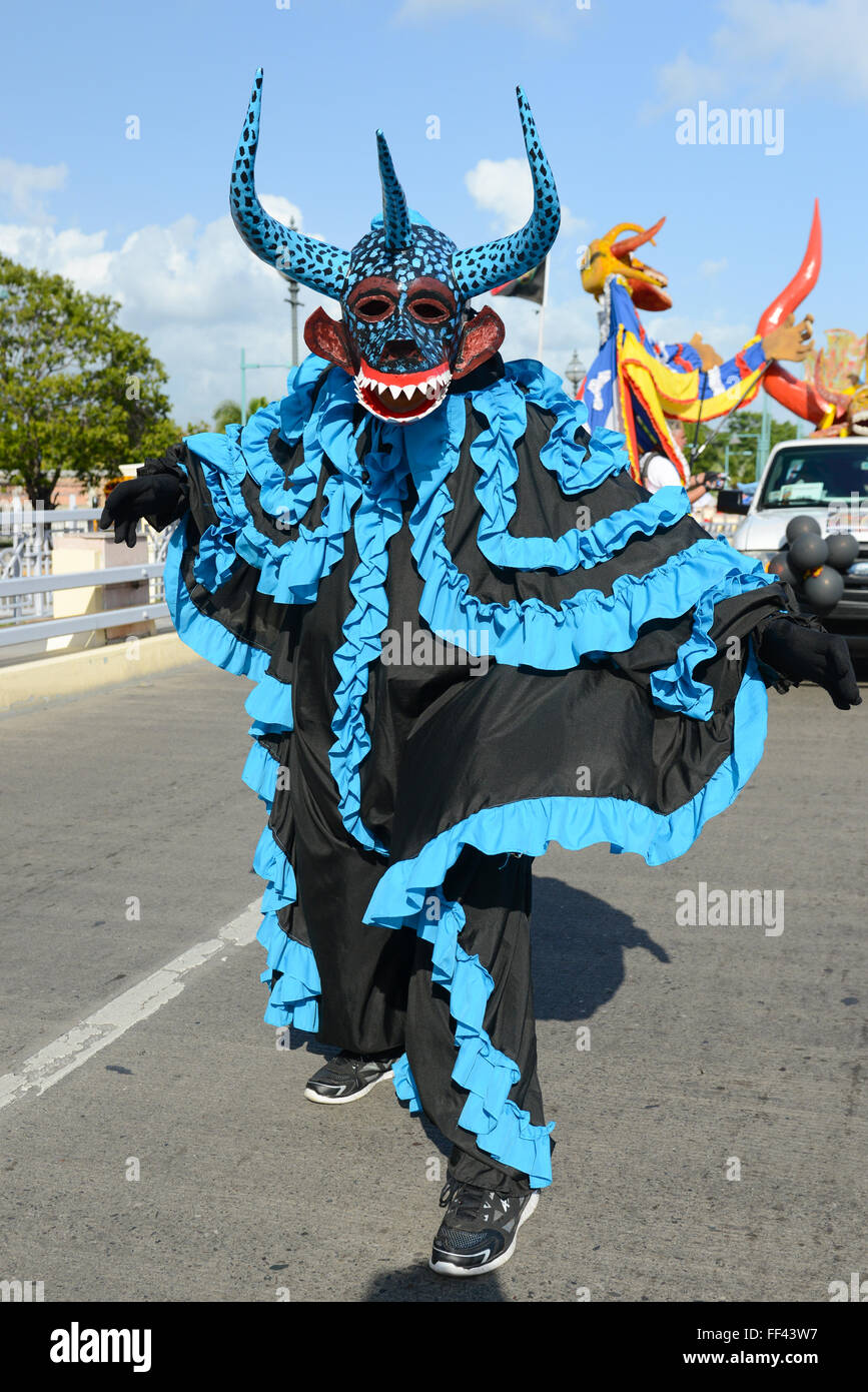Traditional masked cultural figure VEJIGANTE during the carnival parade in Ponce. Puerto Rico. US territory. February 2016 Stock Photo