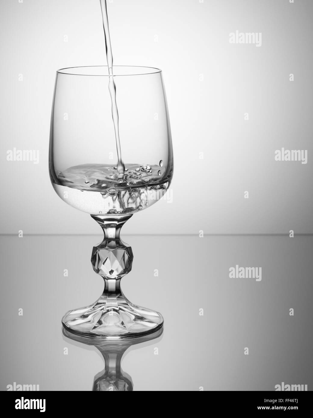 Crystal wine glass filled with sparkling water Stock Photo Alamy