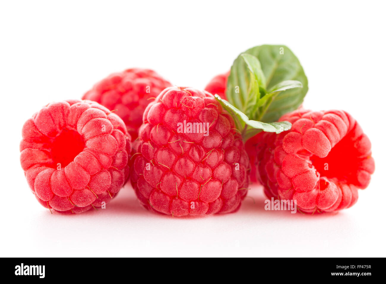 Raspberries with leaves isolated on white background Stock Photo - Alamy