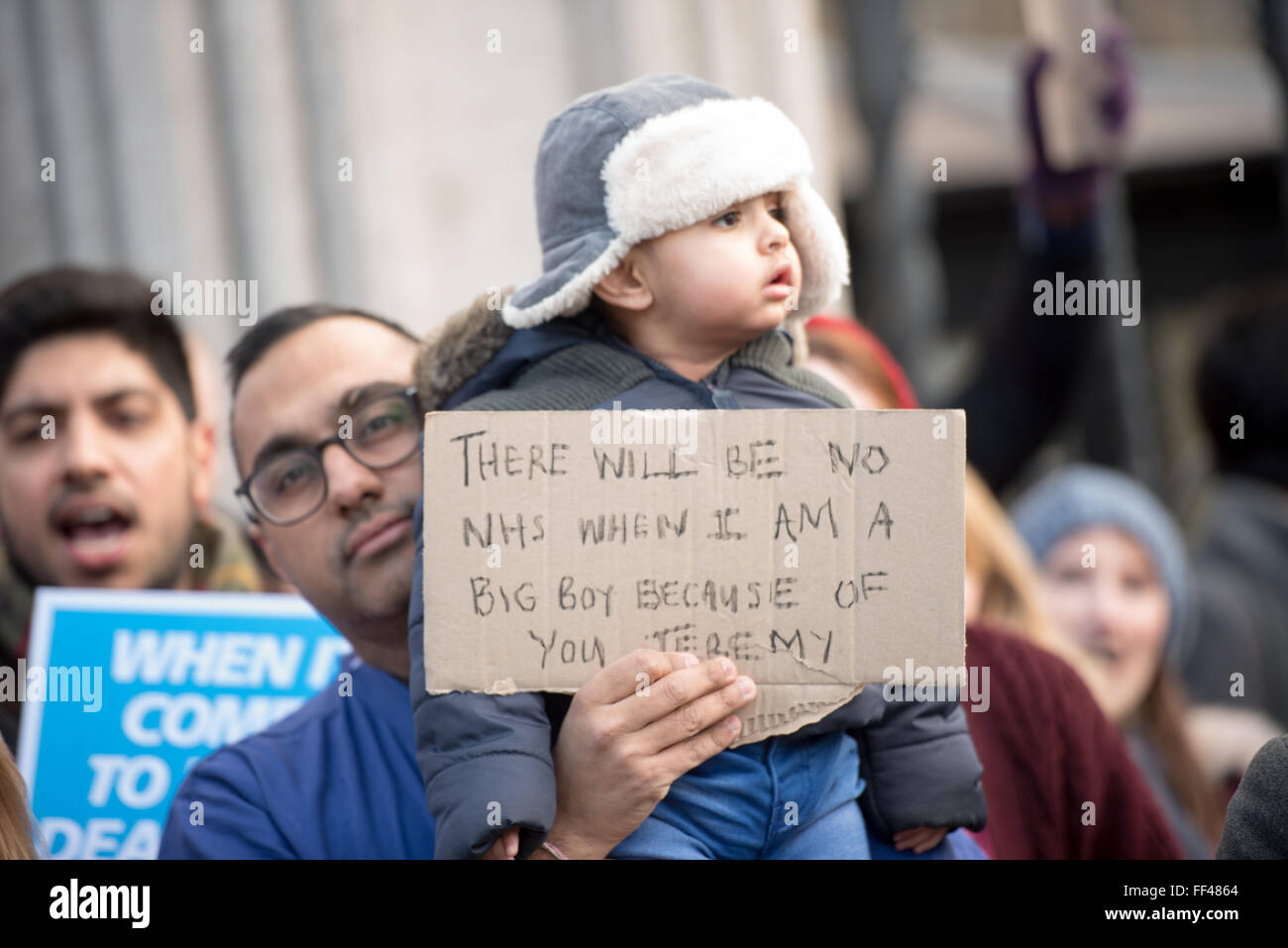 London, UK. 10th February, 2016.  Junior doctor's child with banner Credit:  Ian Davidson/Alamy Live News Stock Photo