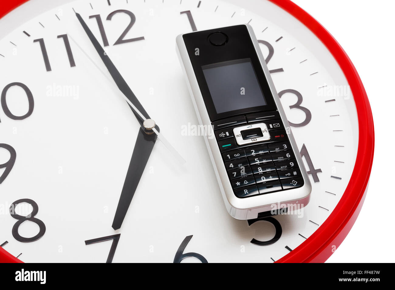 Modern phone on a dial of clock Stock Photo Alamy