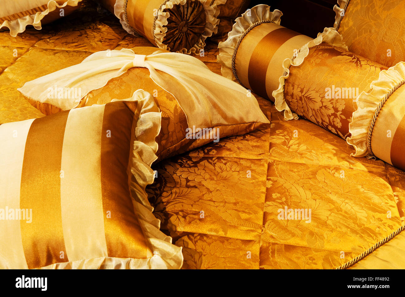 beautiful yellow pillows on the beds of modern Stock Photo Alamy