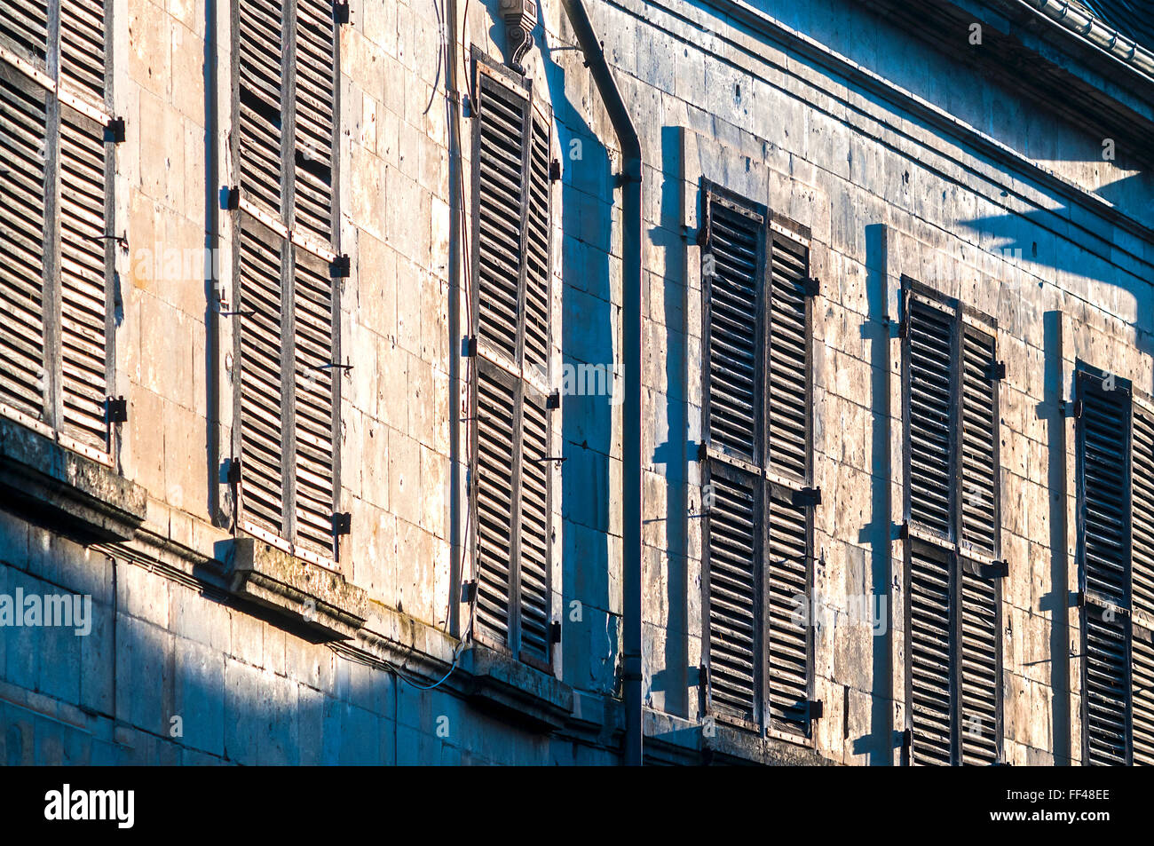 Traditional old wooden window shutters - France. Stock Photo