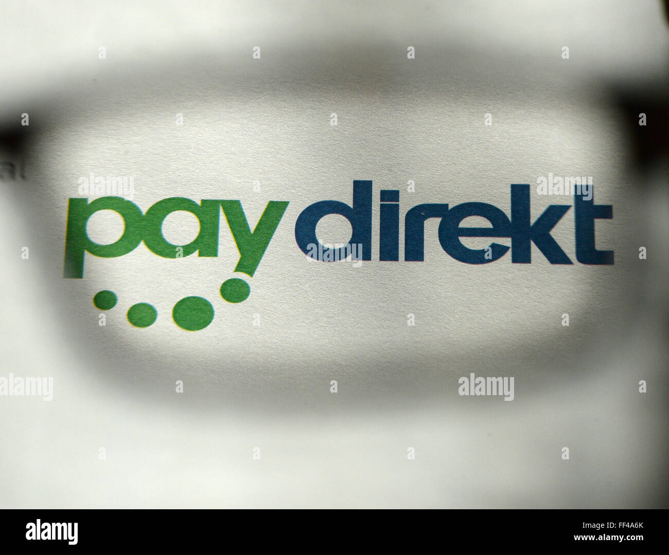 ILLUSTRATION - The logo of the online payment service Paydirekt photographed through a pair of glasses in Berlin, Germany, 03 February 2016. Paydirekt is a German company with a strict data protection policy that will not reroute funds to intermediary payment service providers. Payment transactions are included in regular account statements. Photo: JENS KALAENE/dpa Stock Photo