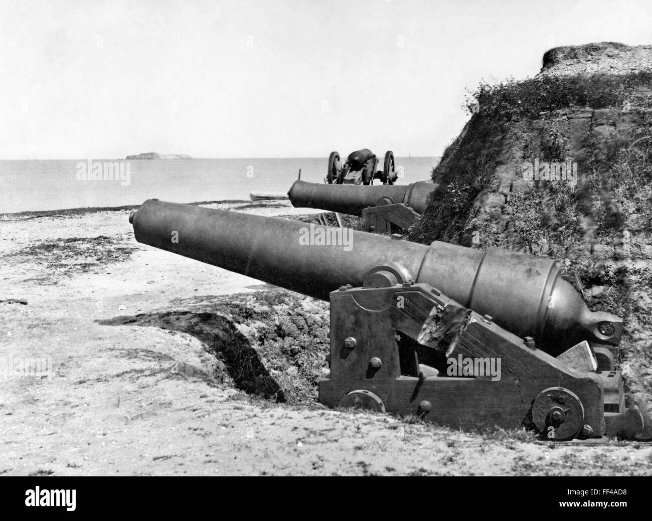 Gun battery at Fort Johnson, Charleston Harbor, S.C. with Fort Sumter