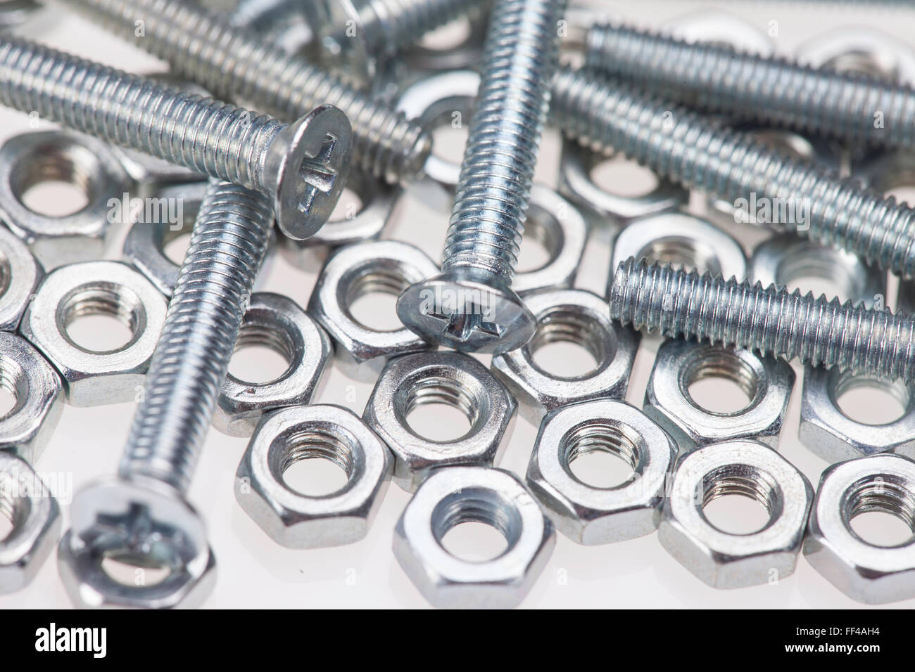 metal bolts and nuts closeup on white background Stock Photo