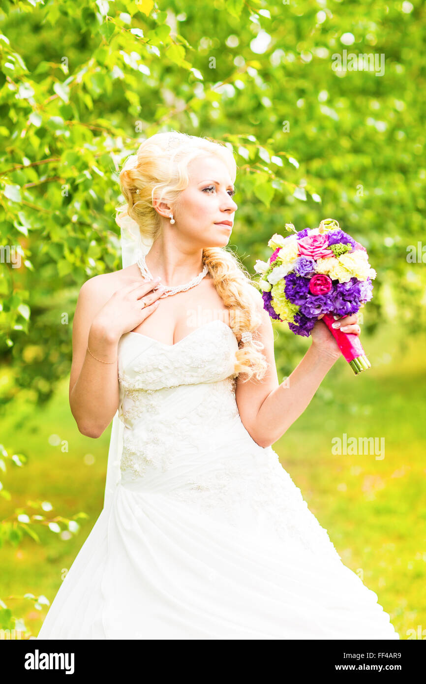 bridal bouquet of flowers in hands of the bride Stock Photo - Alamy