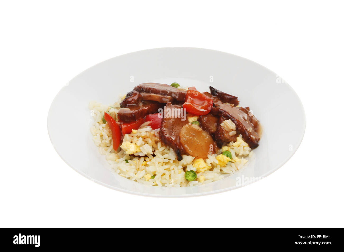 Chinese meal, duck in plum sauce with egg fried rice in a bowl isolated against white Stock Photo