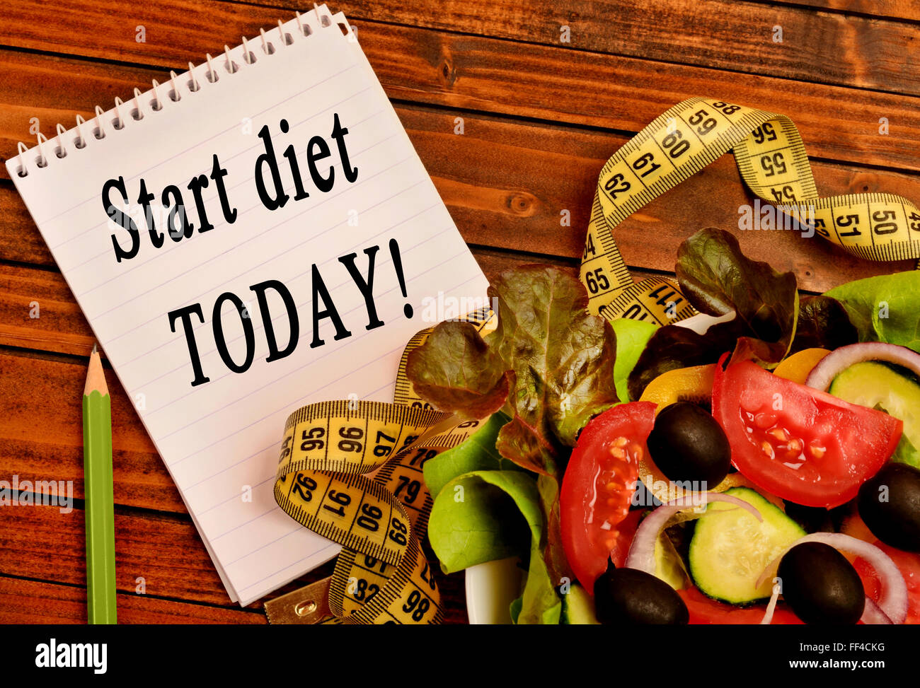Start diet today written on notebook Stock Photo
