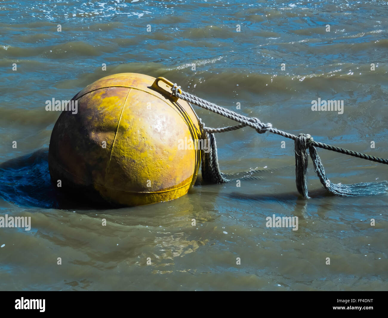 Huge yellow buoy floating in the River Thames Stock Photo Alamy
