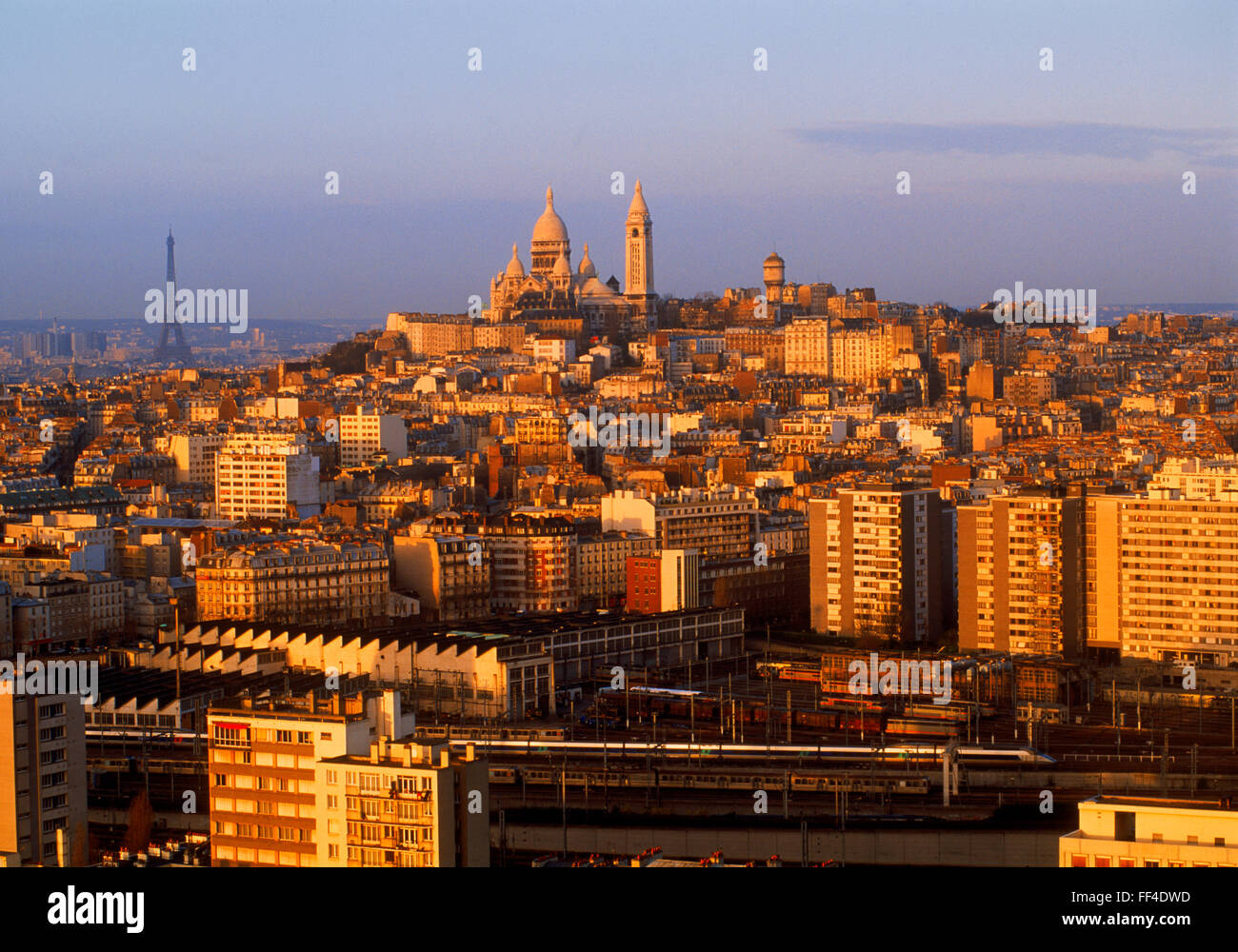 Sacre-Coeur and Eiffel Tower above Paris skyline at sunrise Stock Photo