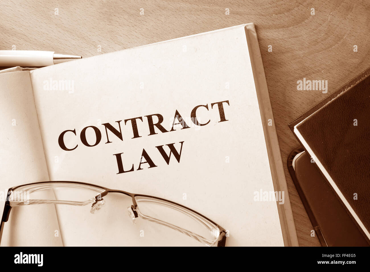 Code of contract law on a wooden table. Stock Photo