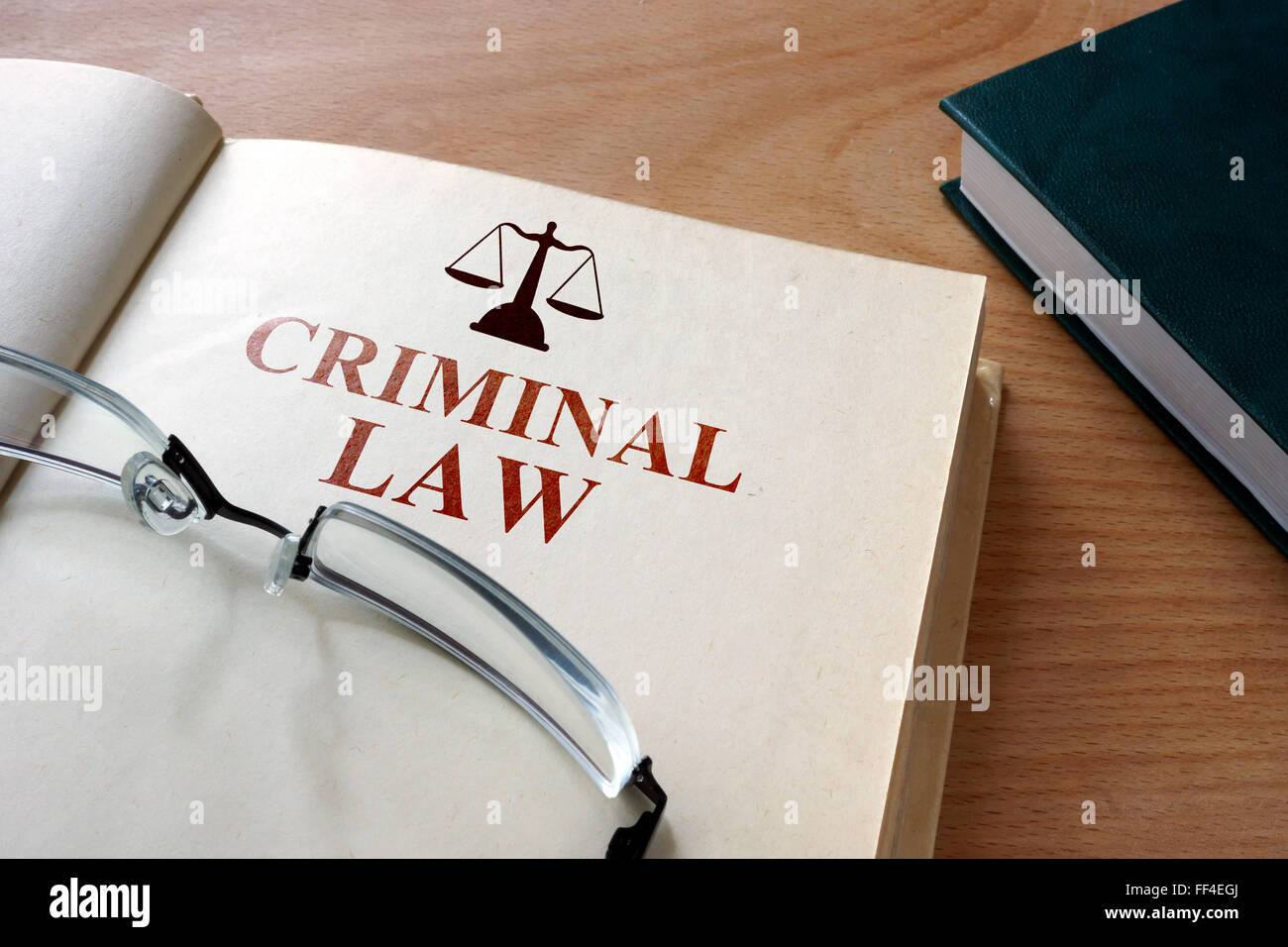 Code of  criminal law on a wooden table. Stock Photo