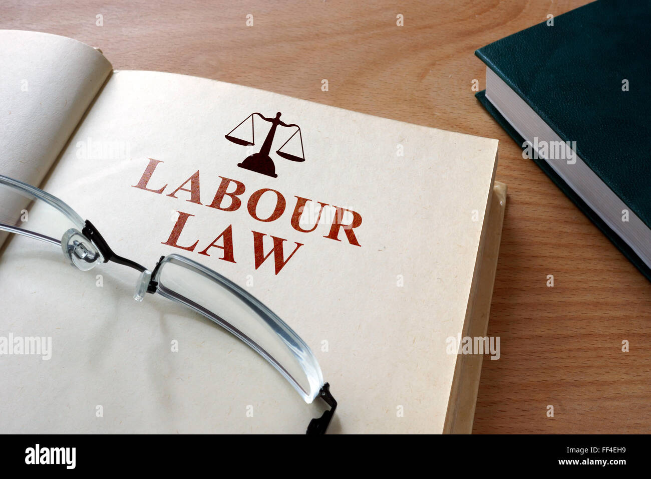 Code of  labour law on a wooden table. Stock Photo