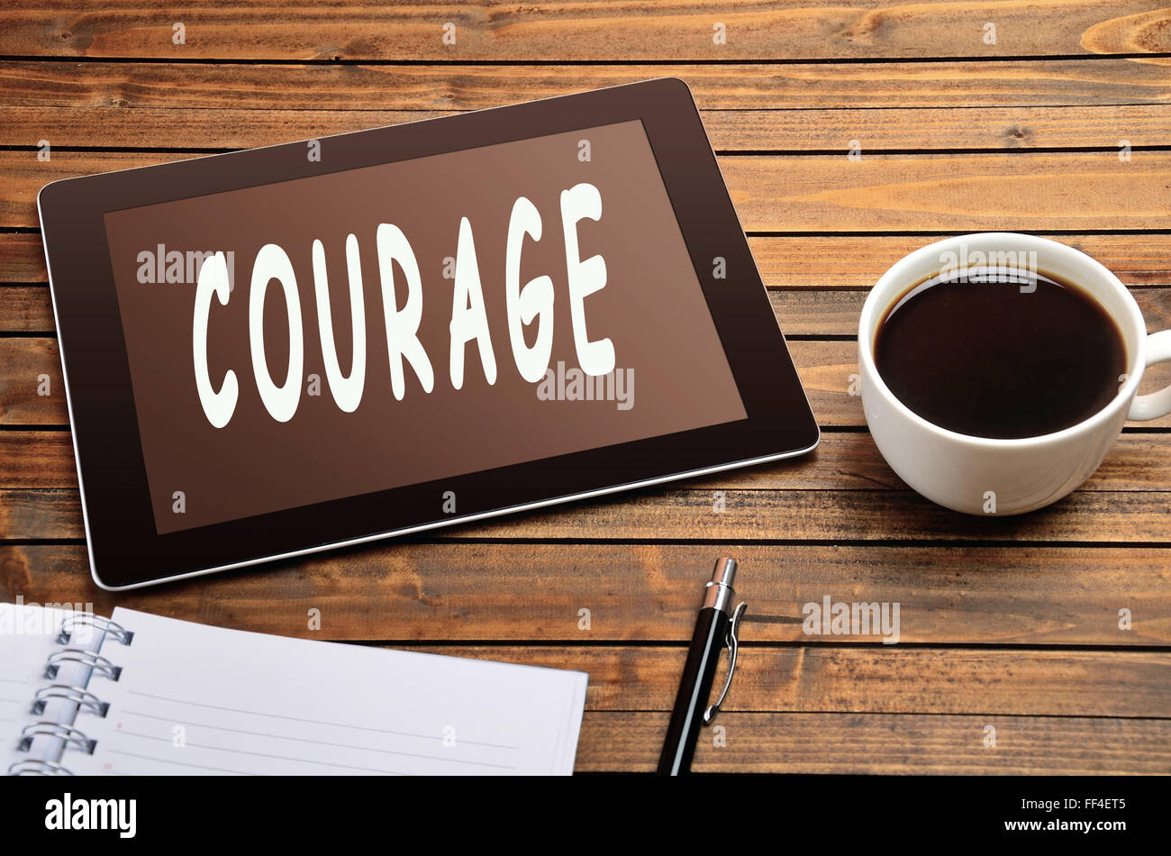 Courage word on digital tablet Stock Photo