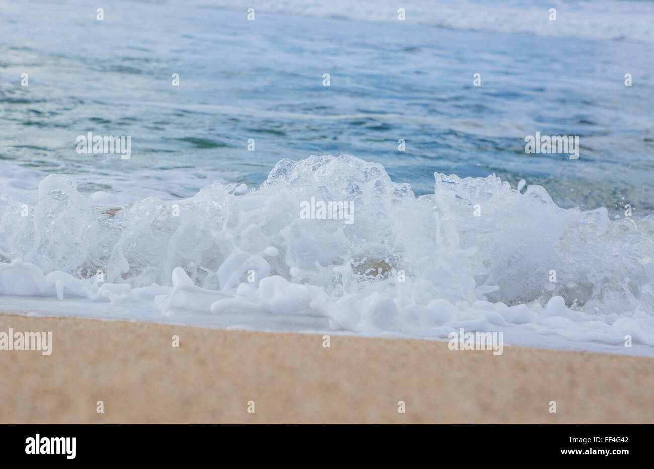 Beach foam splashes Stock Photo