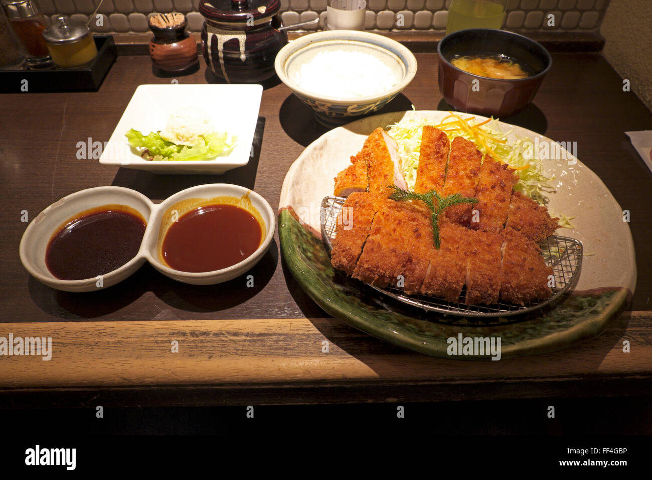 A serving of miso katsu (pork cutlet with miso sauce) at Yabaton restaurant, Nagoya Stock Photo