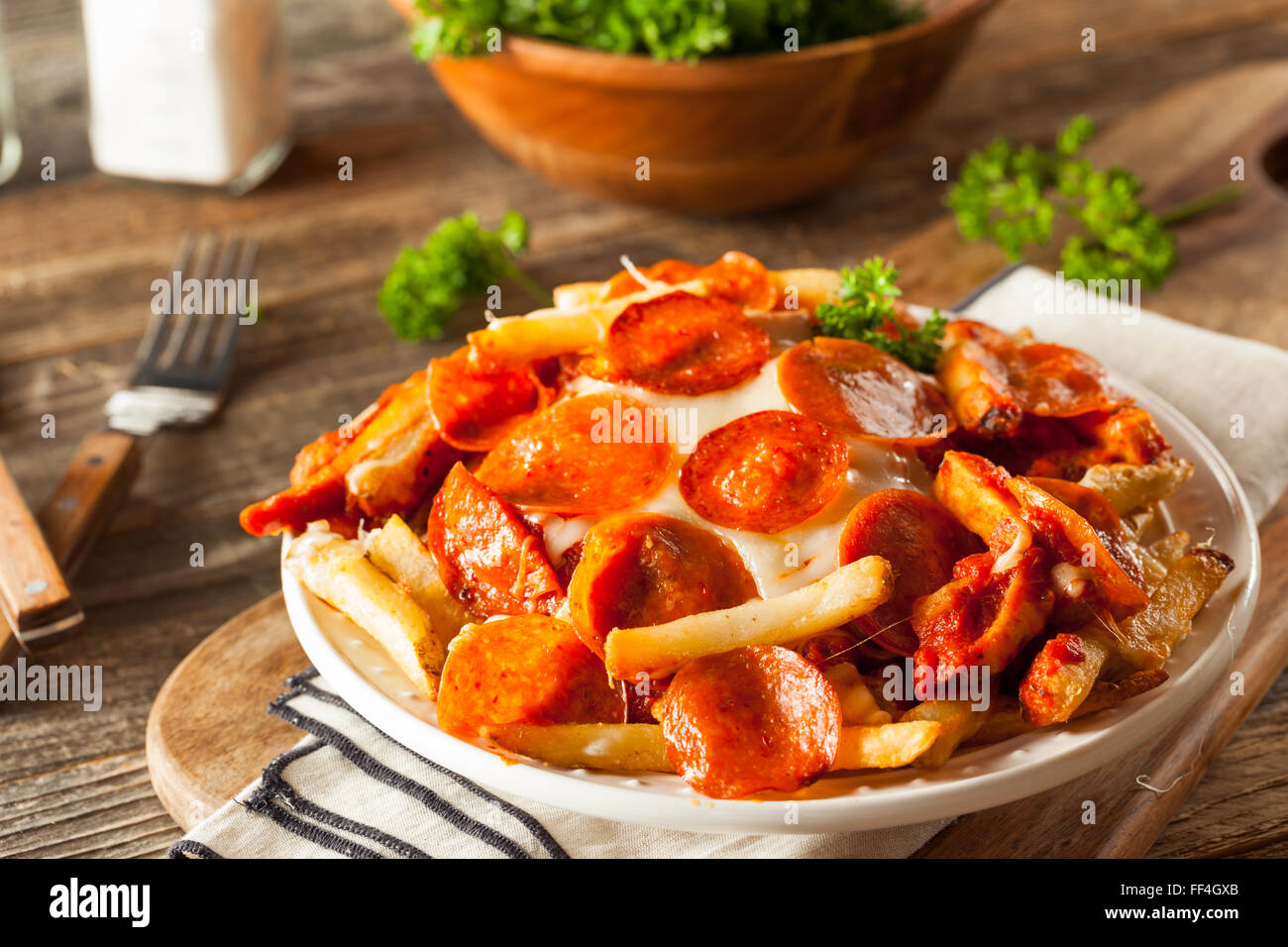 Homemade Pepperoni and Cheese PIzza French Fries with Sauce Stock Photo