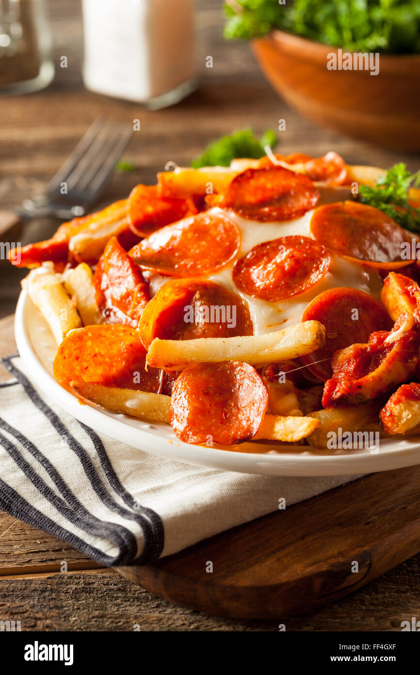 Homemade Pepperoni and Cheese PIzza French Fries with Sauce Stock Photo