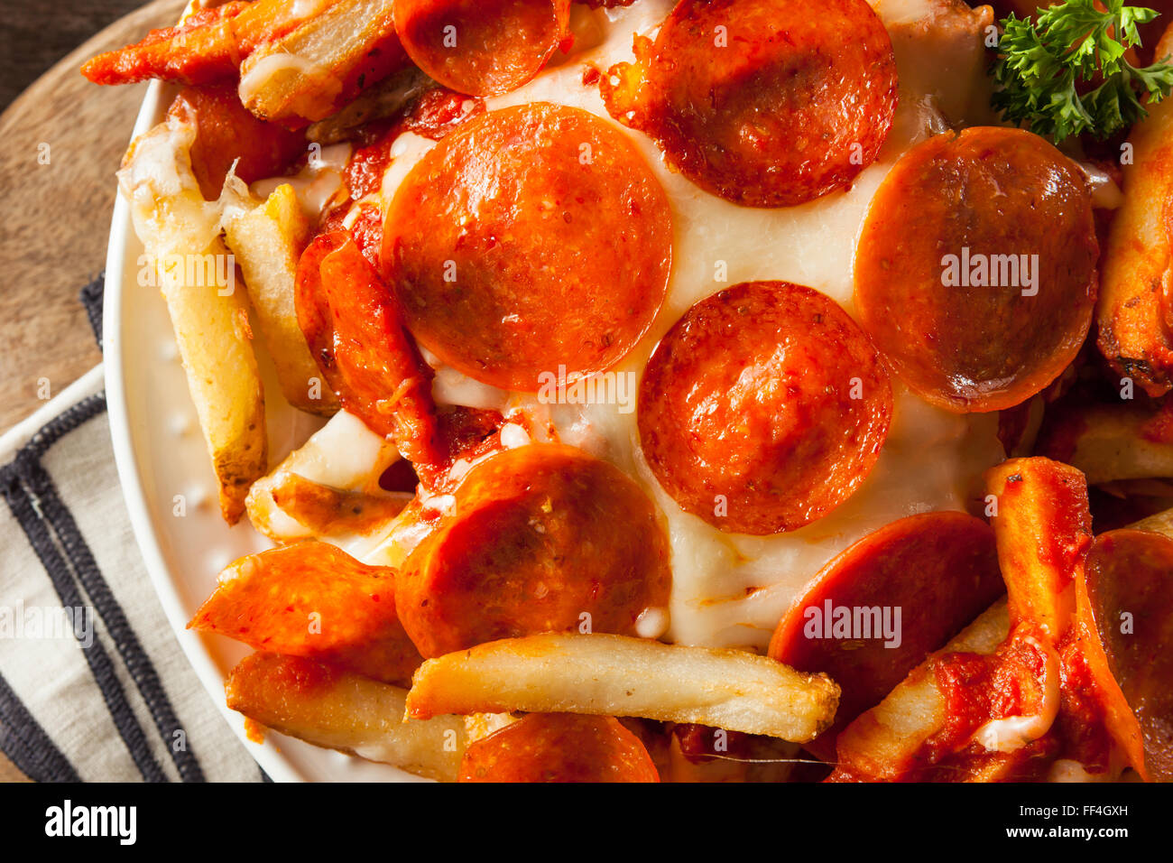 Homemade Pepperoni and Cheese PIzza French Fries with Sauce Stock Photo