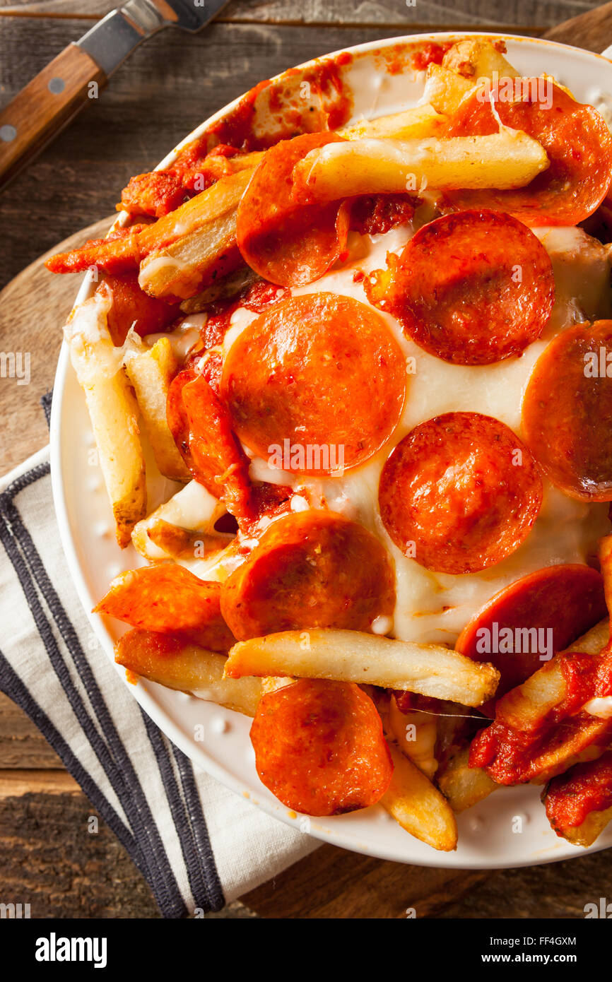 Homemade Pepperoni and Cheese PIzza French Fries with Sauce Stock Photo