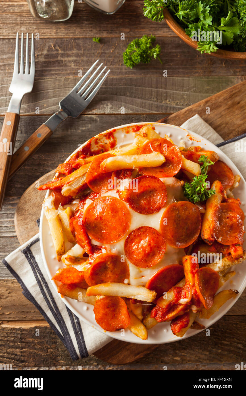 Homemade Pepperoni and Cheese PIzza French Fries with Sauce Stock Photo