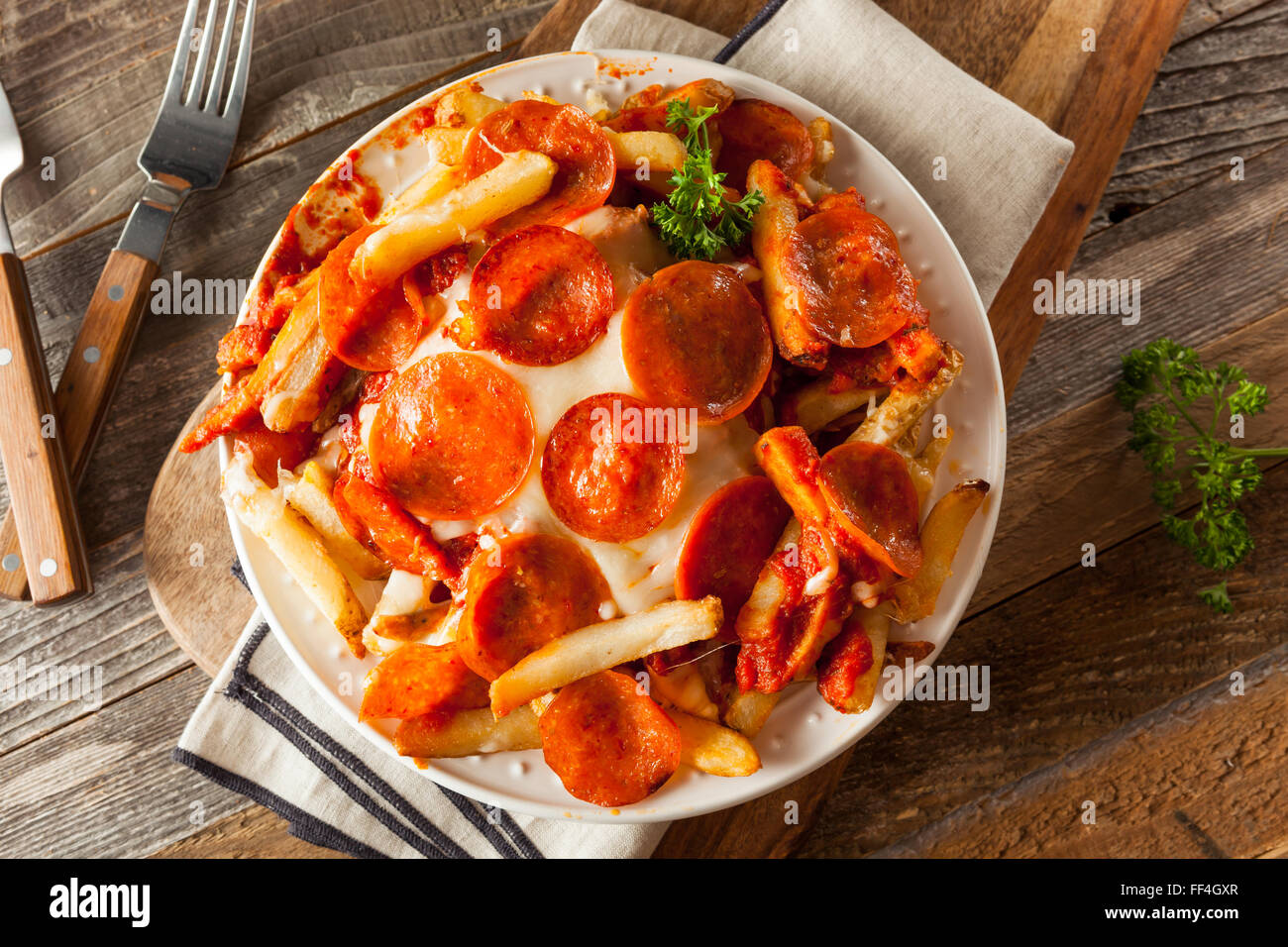 Homemade Pepperoni and Cheese PIzza French Fries with Sauce Stock Photo