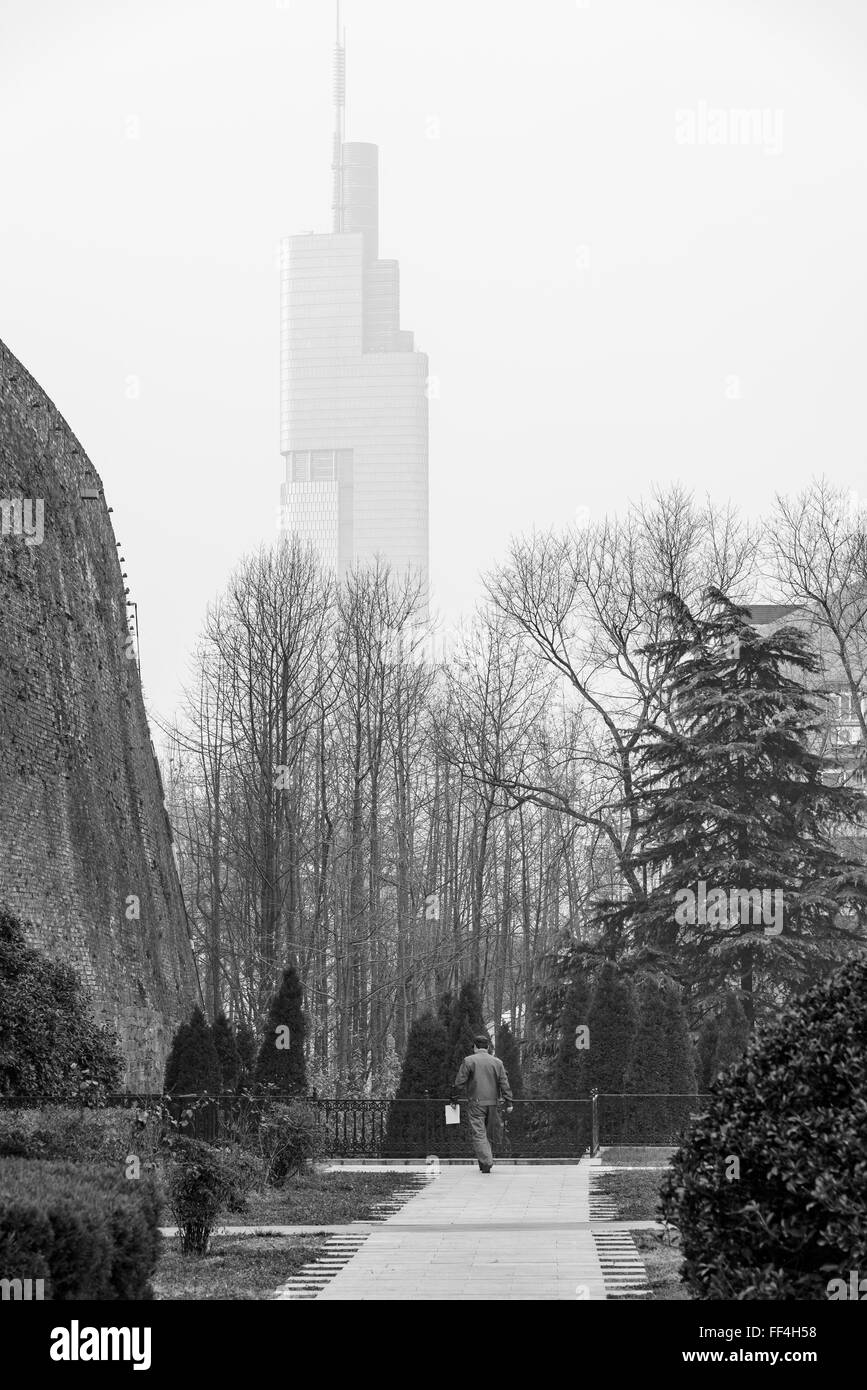 Tallest tower of Nanjing behind the old wall of Nanjing city, China. Stock Photo