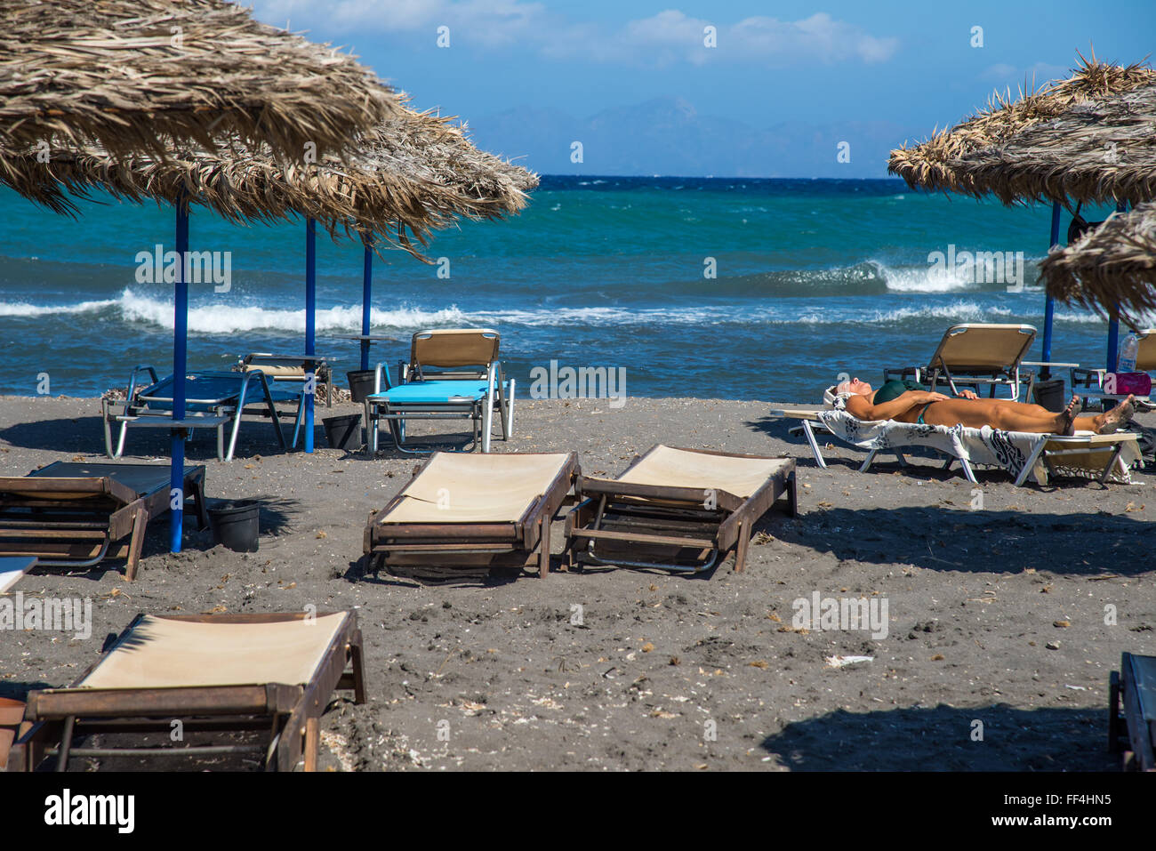 black vulcanic beach at artemis santorini greece Stock Photo