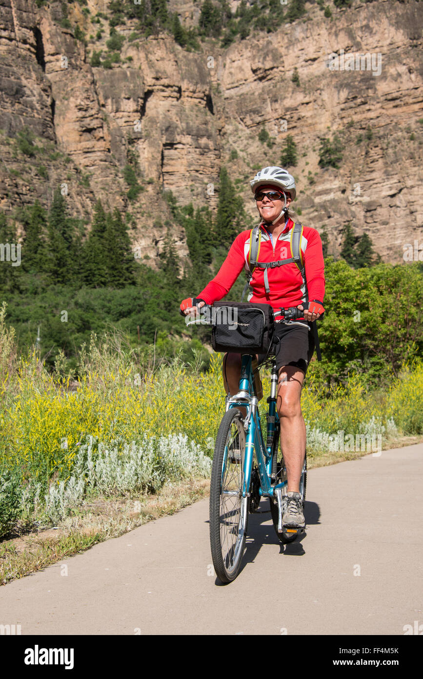 Woman bicycles the Glenwood Canyon Bike Trail, Glenwood Springs