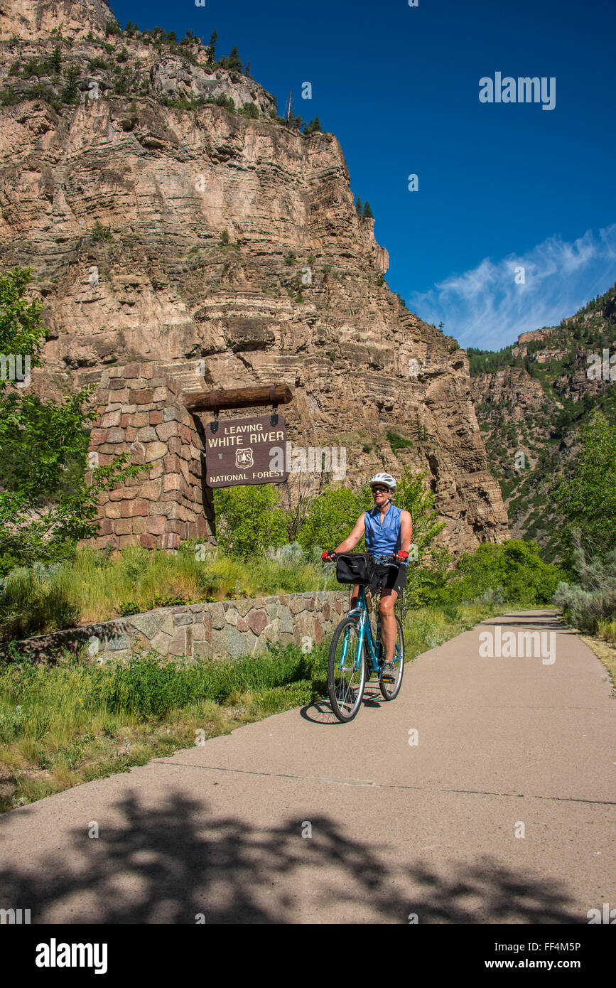 Woman bicycles the Glenwood Canyon Bike Trail, Glenwood Springs