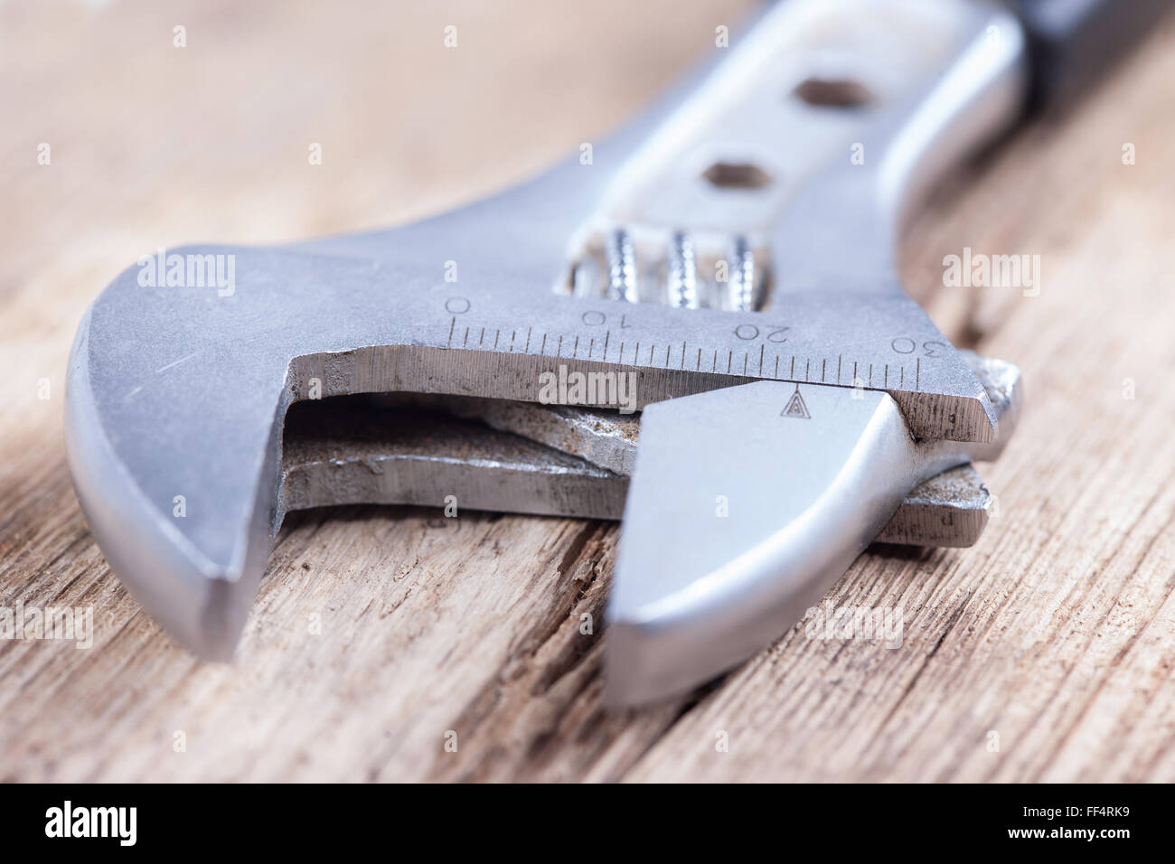 wrench background on grungy wood surface Stock Photo Alamy