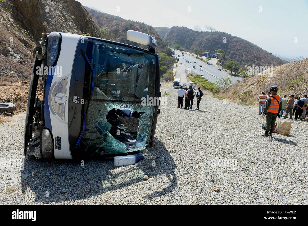 Caracas-La Guaira highway, Vargas state, Venezuela. 10th February, 2016. A bus transporting the Argentine soccer team Huracan is seen after the accident at Caracas-La Guaira highway, Vargas state, Venezuela, on Feb. 10, 2016. Five soccer players and a physical trainer from Argentina's Huracan were injured on Wednesday when the bus transporting the team to the Maiquetia 'Simon Bolivar' International Airport, in the central-northern state of Vargas, overturned. Credit:  Xinhua/Alamy Live News Stock Photo