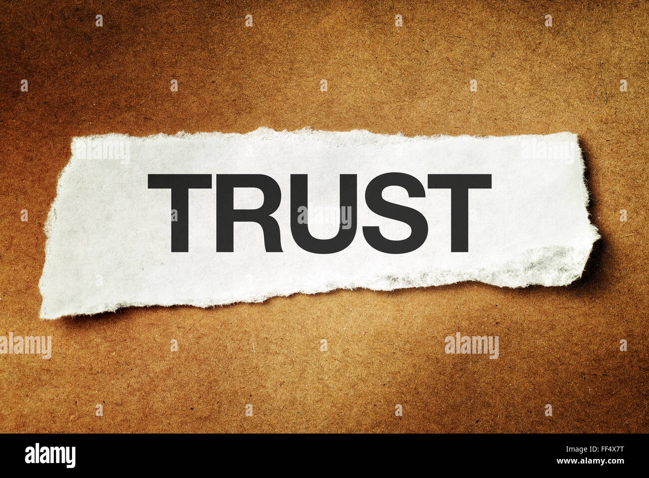 Trust printed on scrap paper, concept of faith, confidence and trustworthy. Stock Photo
