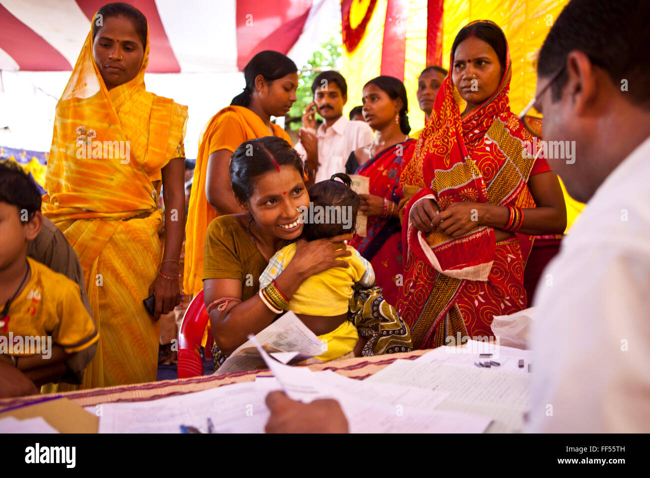 Families from the Dobhanda Nagar slum in Cuttack get legal advice and birth certificates from the Urban Law centre run by the organisation CLAP, Committee for Legal Aid to Poor, helps provide legal aid to the poorer communities in the Orissa district of India. Stock Photo