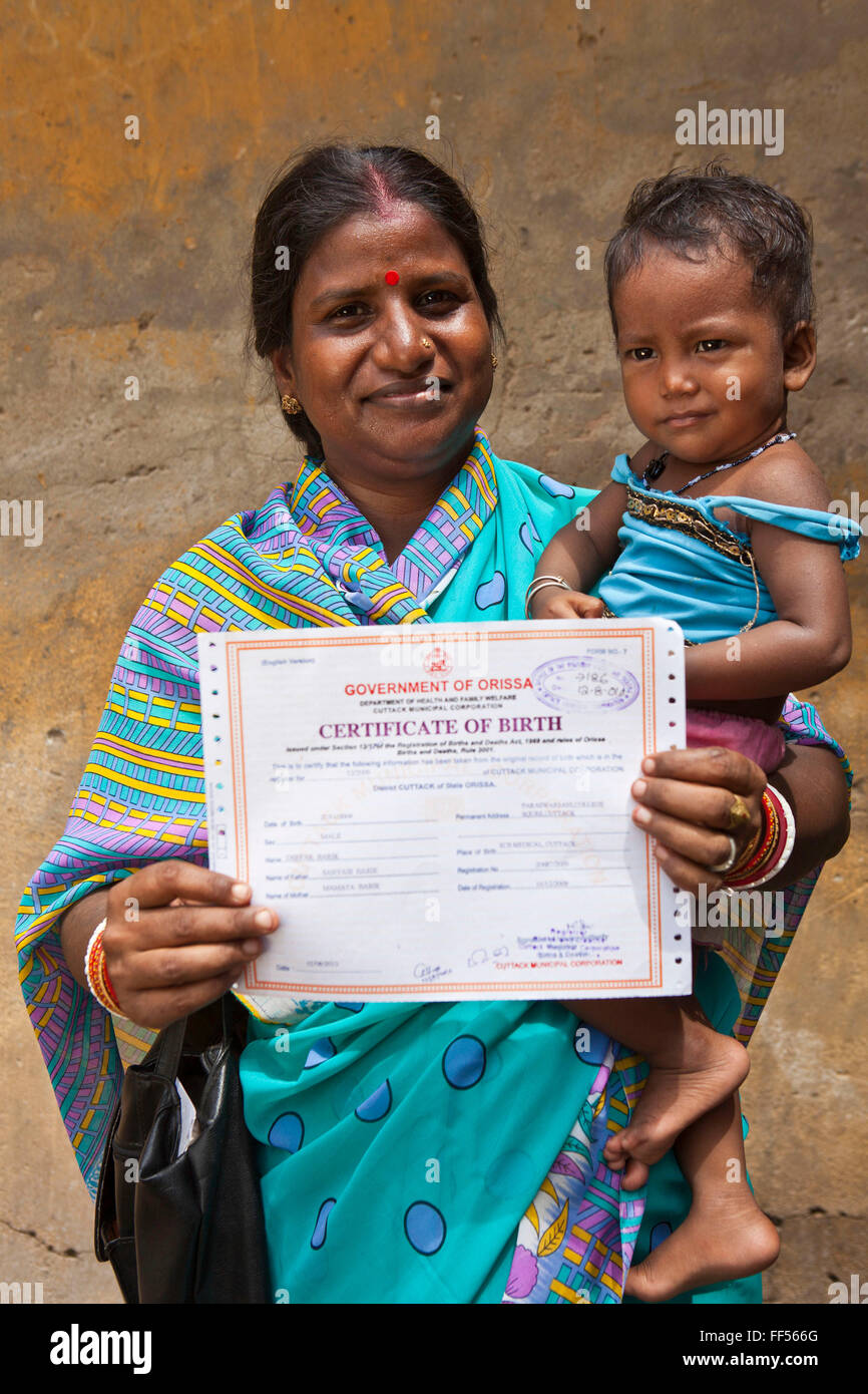A mother and daughter in Cuttack, have just received her birth certificates from the Urban Law Centre run by the organisation CLAP. Committee for Legal Aid to Poor (CLAP), helps provide legal aid to the poorer communities in the Orissa district of India. Stock Photo