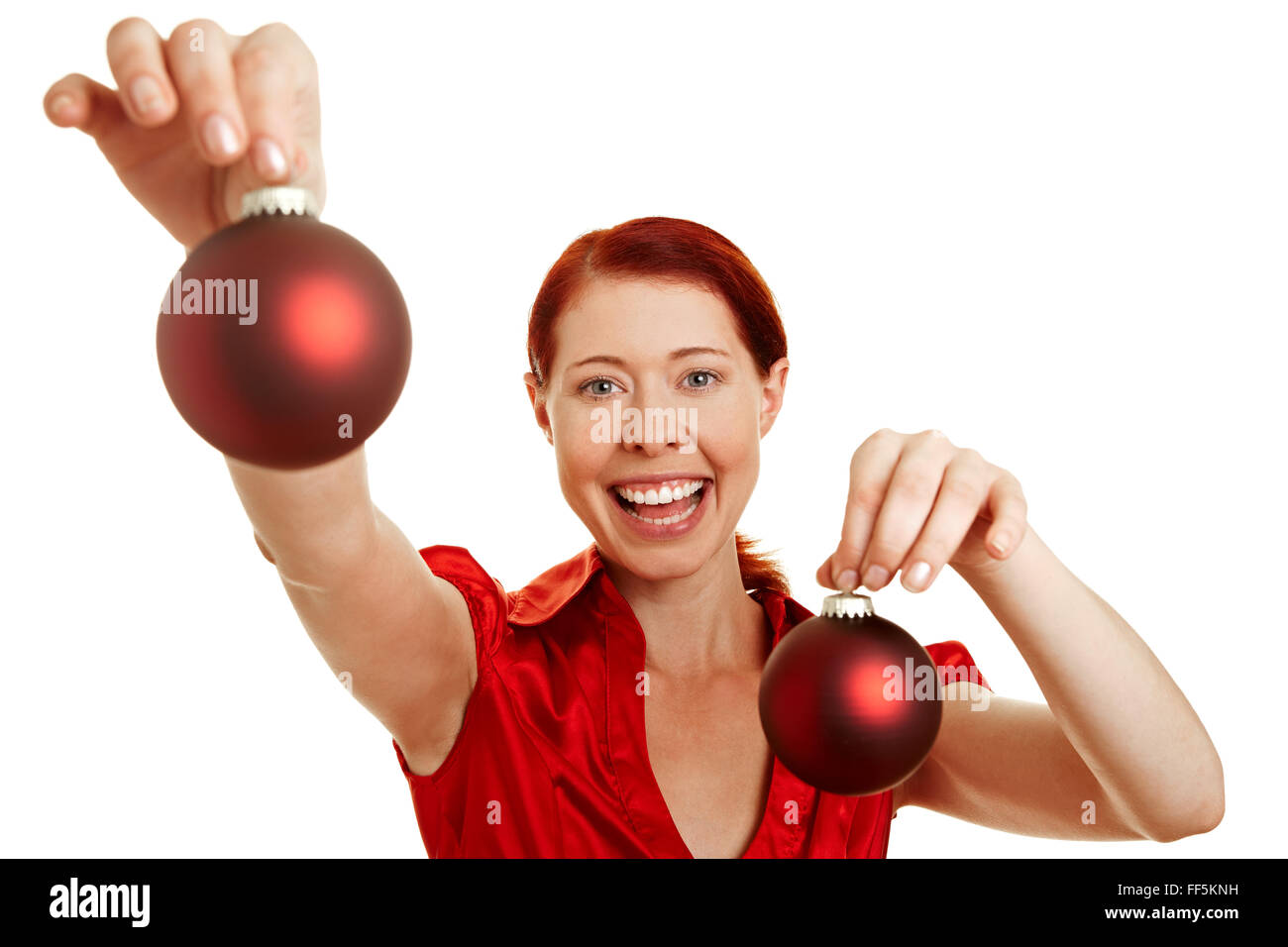 Redhaired woman with two red christmas tree balls Stock Photo