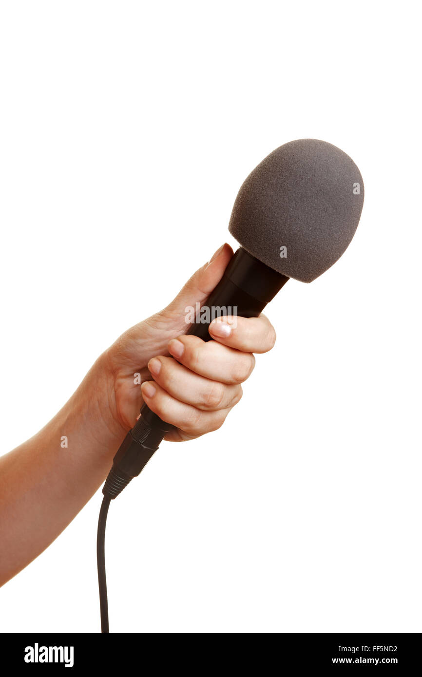 Hand holding a microphone with a windscreen Stock Photo