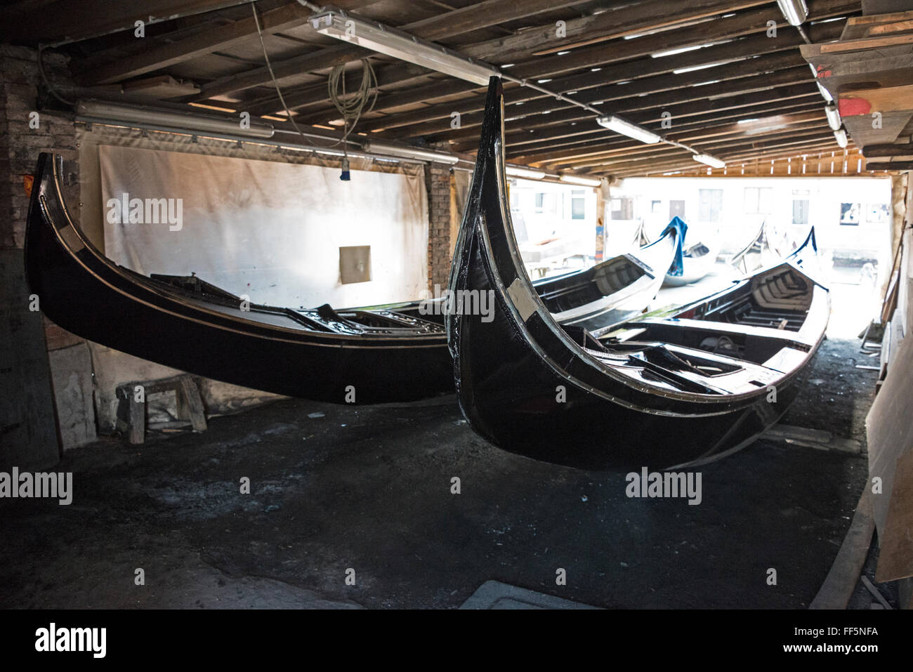 Two restored black gondolas always painted black required by a
