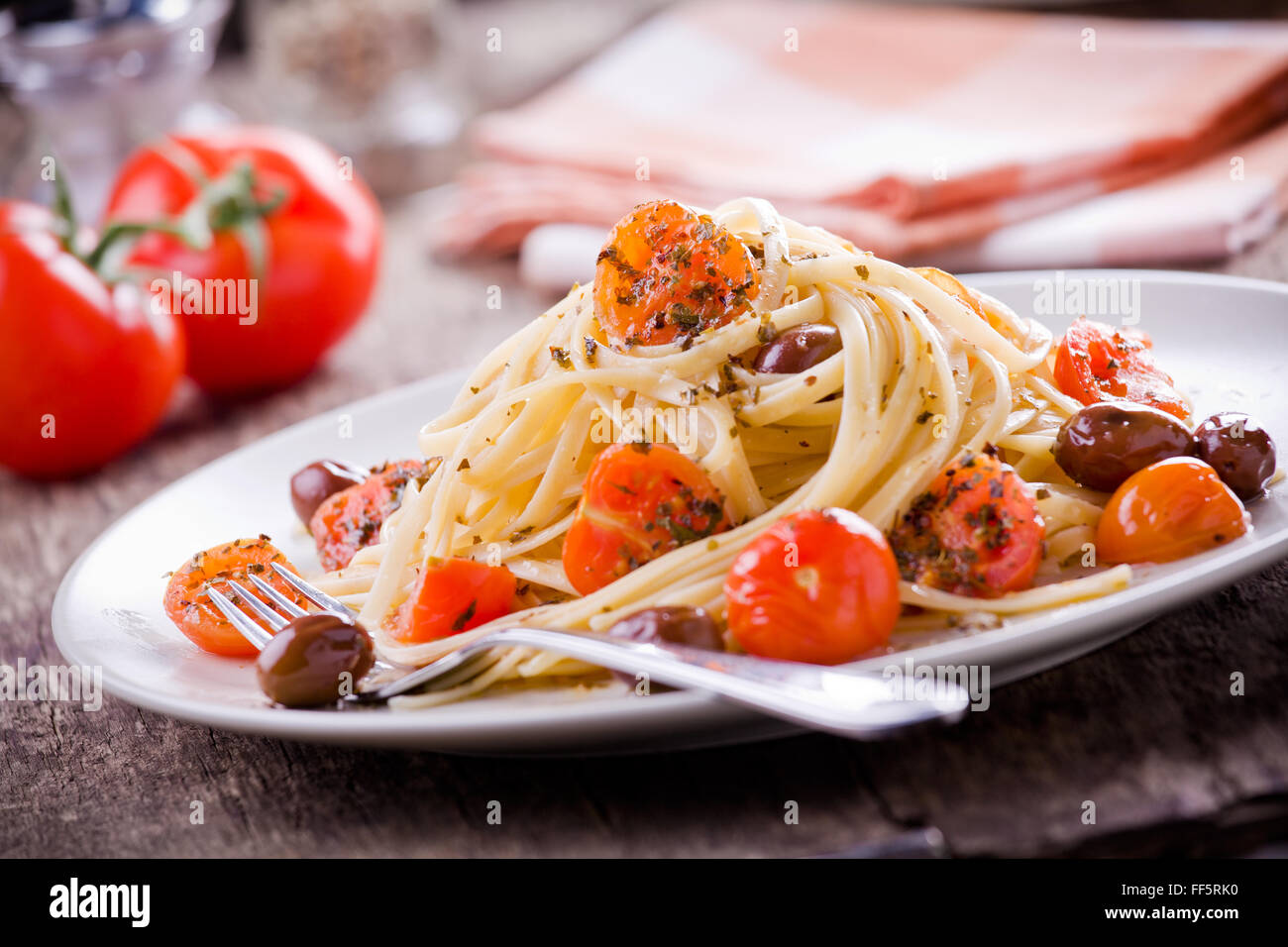 Pasta With Fresh Tomatoes And Olives Stock Photo