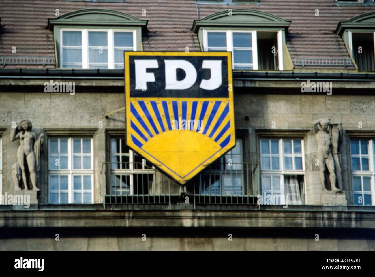 geography / travel, Germany, organizations, Free German Youth (FDJ), emblem, Unter den Linden, East-Berlin, 20th century, historic, historical, Under the Linden, symbol, youth organization, youth organizations, Berlin, GDR, DDR, East-Germany, East Germany, socialistic, sun, inordinate, oversized, inordinately large, propaganda, Additional-Rights-Clearences-Not Available Stock Photo