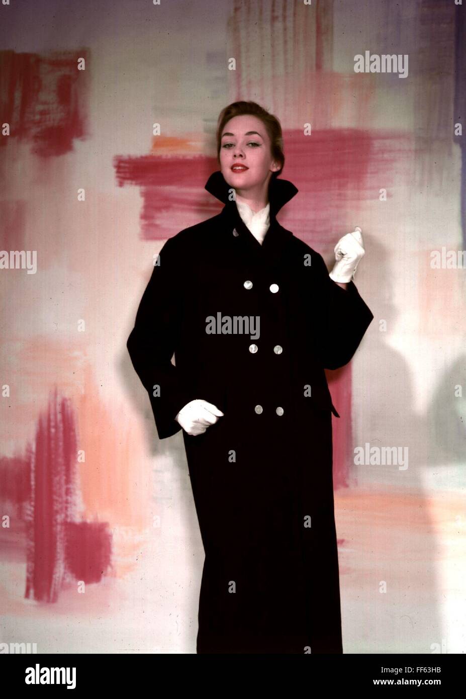 Woman poses wearing long coat hi-res stock photography and images - Alamy
