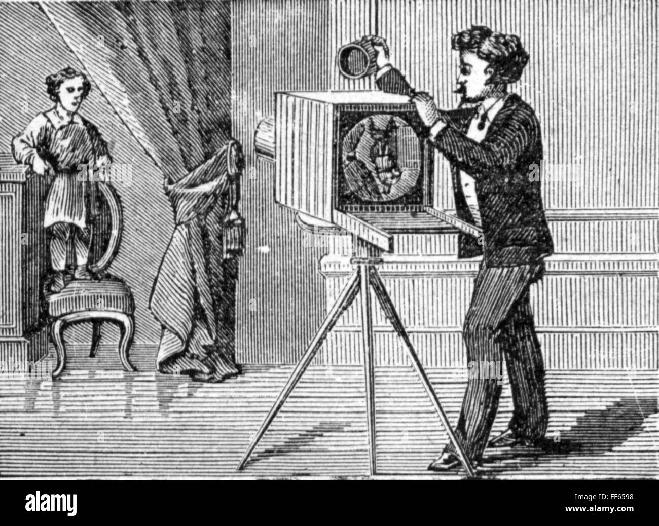photography, photographer, photographer taking picture photo of a child, wood engraving, 19th century, 19th century, graphic, graphics, occupation, occupations, photographer's studio, photographer's salon, studio, atelier, artist's workroom, ateliers, artist's workrooms, studios, taking a photo, taken a photo, take a picture, take a photograph, sitter, pose, full length, standing, tripod, tripods, chair, chairs, photo camera, camera, cameras, photographer, photographers, historic, historical, man, men, male, child, people, Additional-Rights-Clearences-Not Available Stock Photo