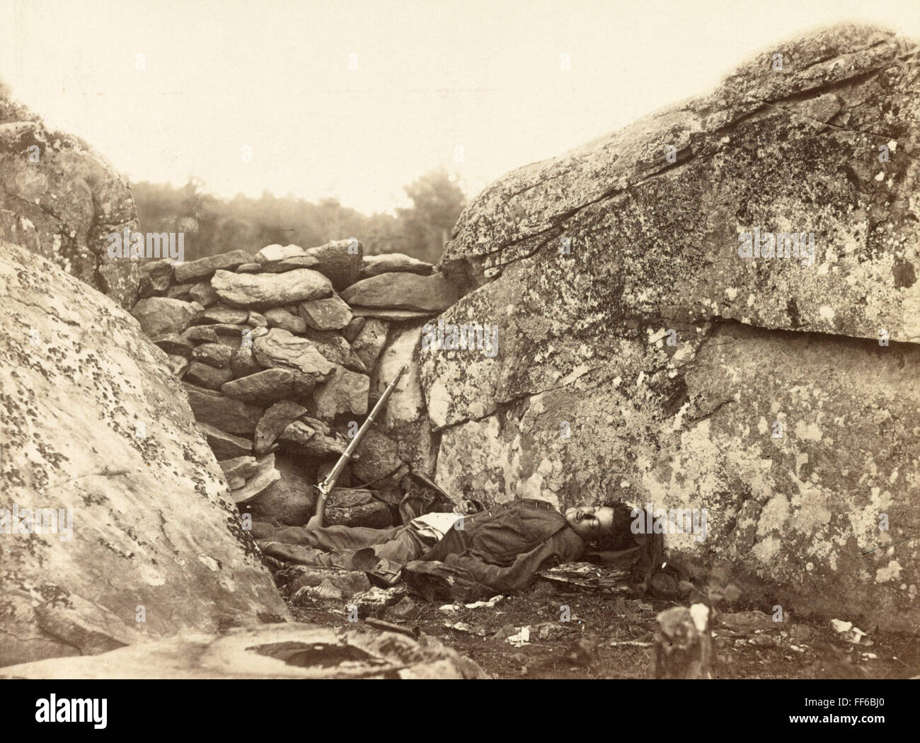 CONFEDERATE SOLDIER. /nDead Confederate sharpshooter at the foot of
