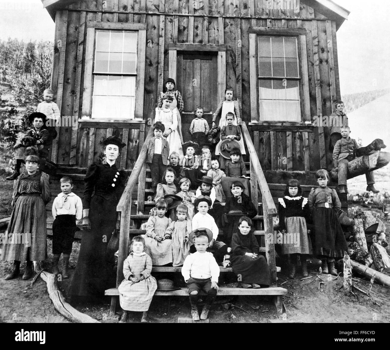 SCHOOLMISTRESS, 1893./nMiss Blanche Lamont with her school in Hecla