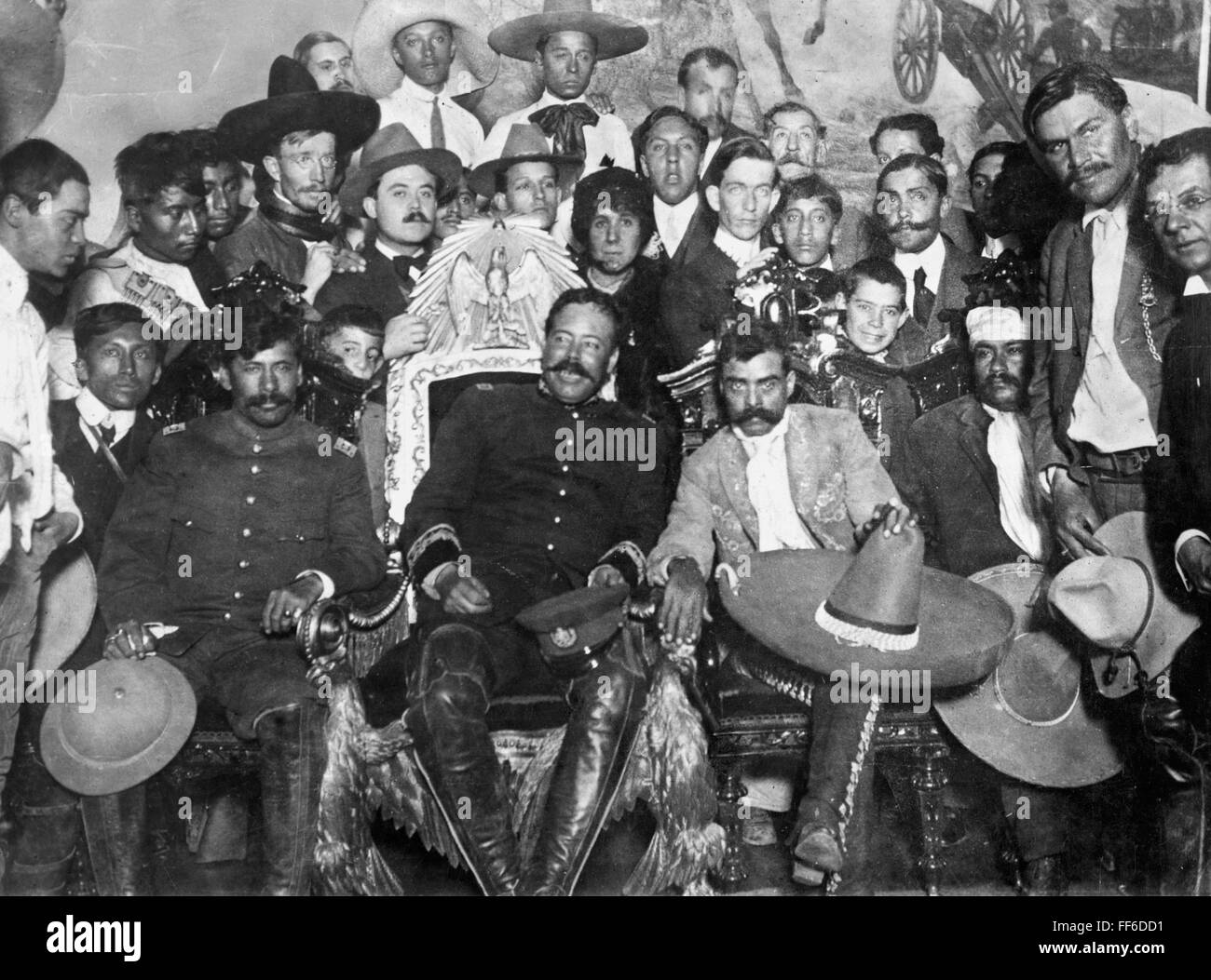 FRANCISCO 'PANCHO' VILLA/n(1878-1923). Mexican revolutionary leader. Villa (center) and Emiliano Zapata (next to Villa, right, with sombrero on knee) in the Presidential Palace at Mexico City. Seated next to them are revolutionary generals Tomßs Urbina (l Stock Photo