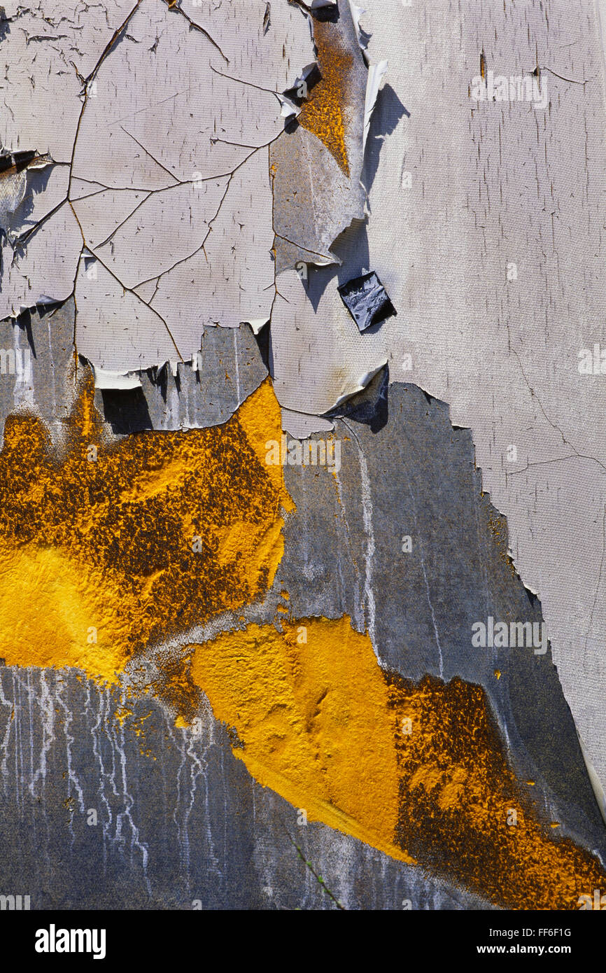 Detail of peeling and cracked paint on an old silo wall. Stock Photo